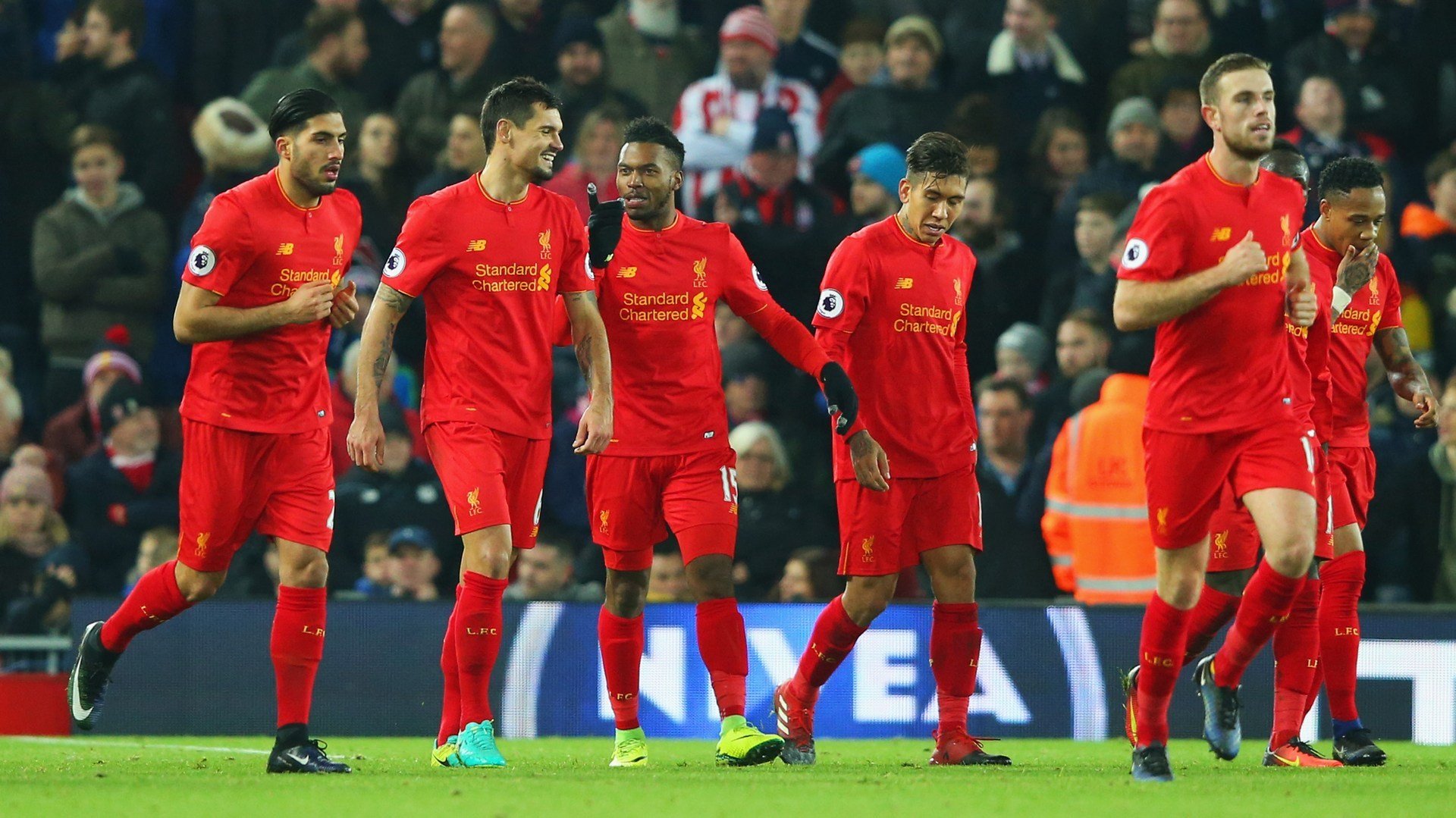 LIVERPOOL, ENGLAND - DECEMBER 27: Daniel Sturridge of Liverpool (15) celebrates with team mates as he scores their fourth goal during the Premier League match between Liverpool and Stoke City at Anfield on December 27, 2016 in Liverpool, England. (Photo by Alex Livesey/Getty Images)